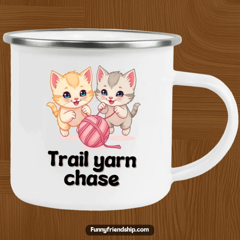 Funny playful kittens chasing a bouncing ball of yarn together on a durable camping mug, ideal for playful outdoor moments