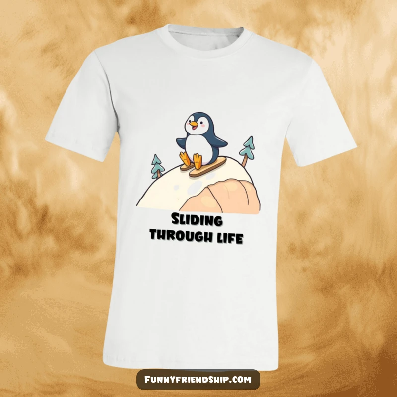 Funny T-shirt featuring a cheerful penguin sliding down a hill with a companion, depicting shared adventure and happiness.